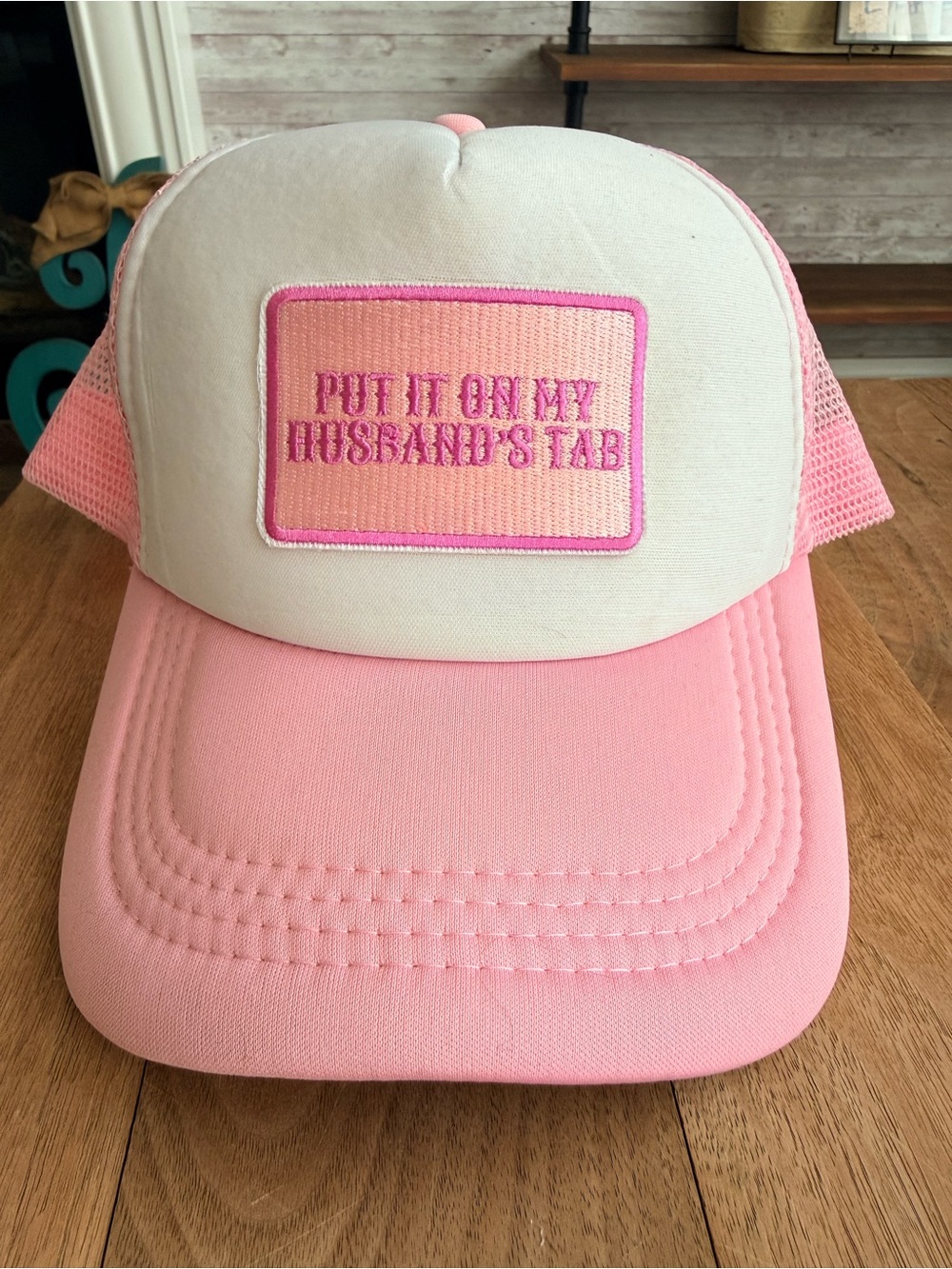Pink and White Trucker Hat with 'Put It On My Husband's Tab' Patch